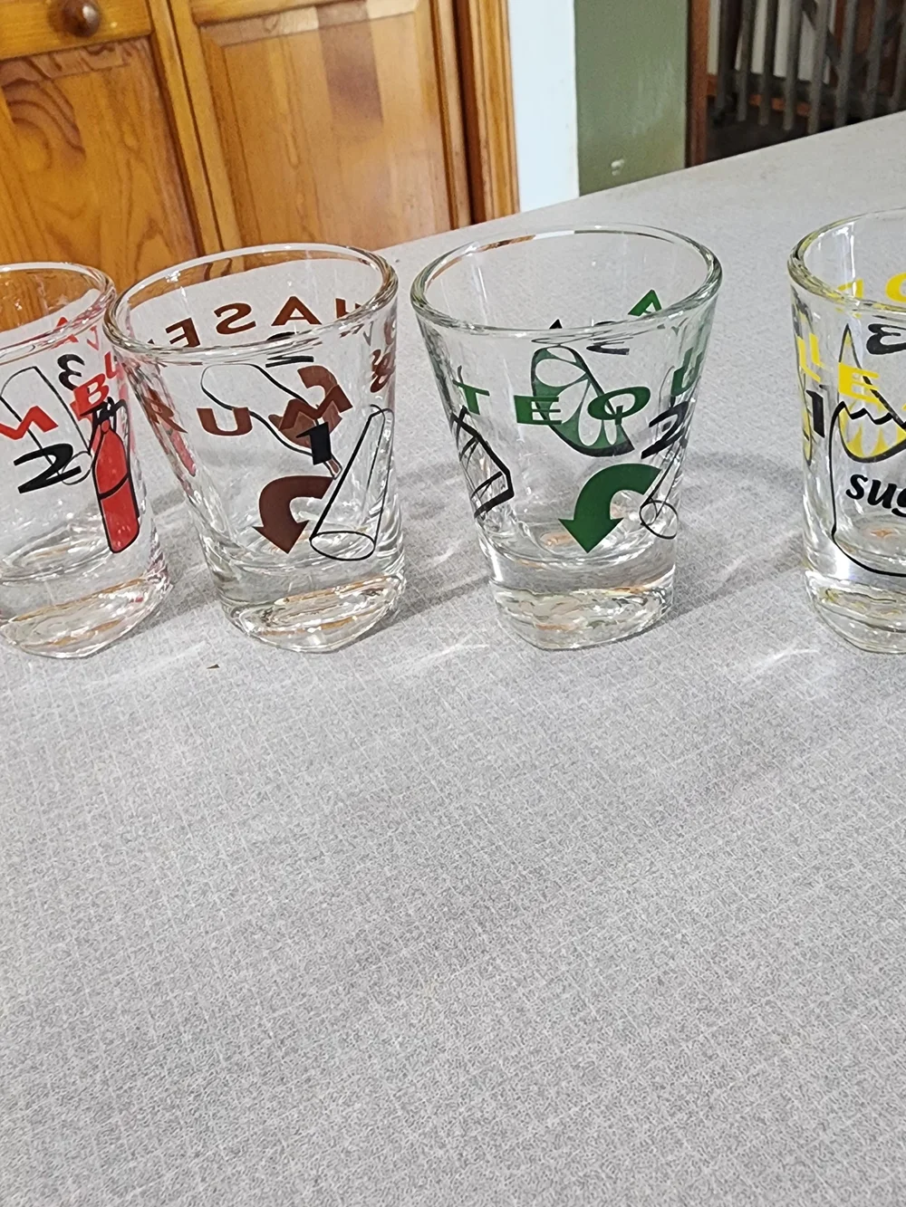 Clear Glass Shot Glasses with Multicolor Icons - Set of 4